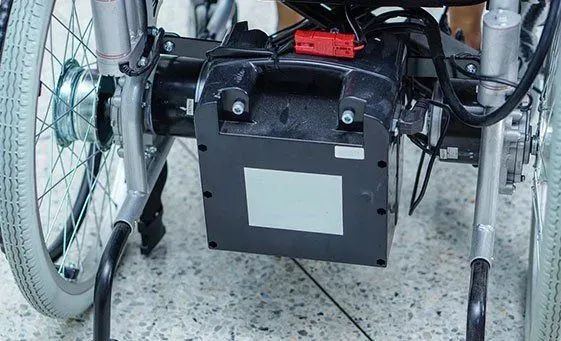 A battery pack on the back of a wheelchair